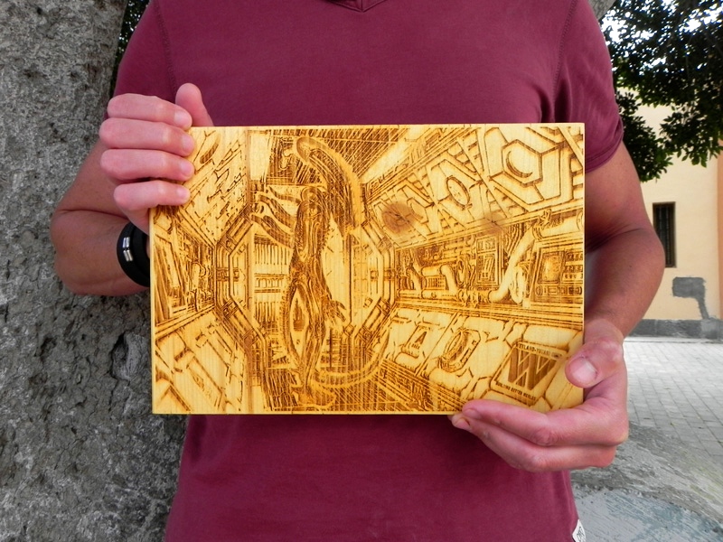“Alien Corridor” by Laser Art Canarias, laser engraved on pine wood, 11,8” x 7,8 “