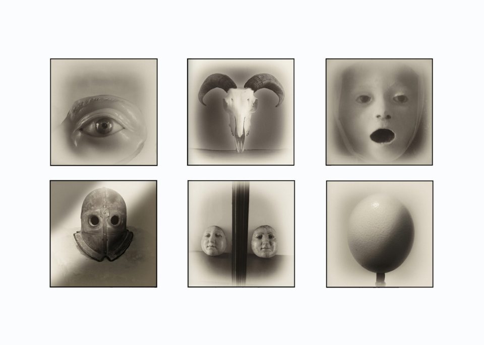 Six surreal monochrome photographs from Armageddon by Augusto De Luca, featuring faces, symbolic objects and dreamlike imagery.
