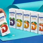 DOMTY juice packaging design by Ramy Mohamed featuring a colourful range of fruit juice cartons