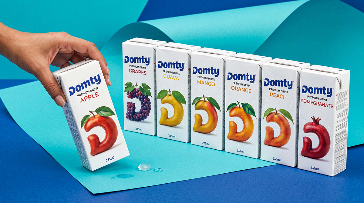 DOMTY juice packaging design by Ramy Mohamed featuring a colourful range of fruit juice cartons